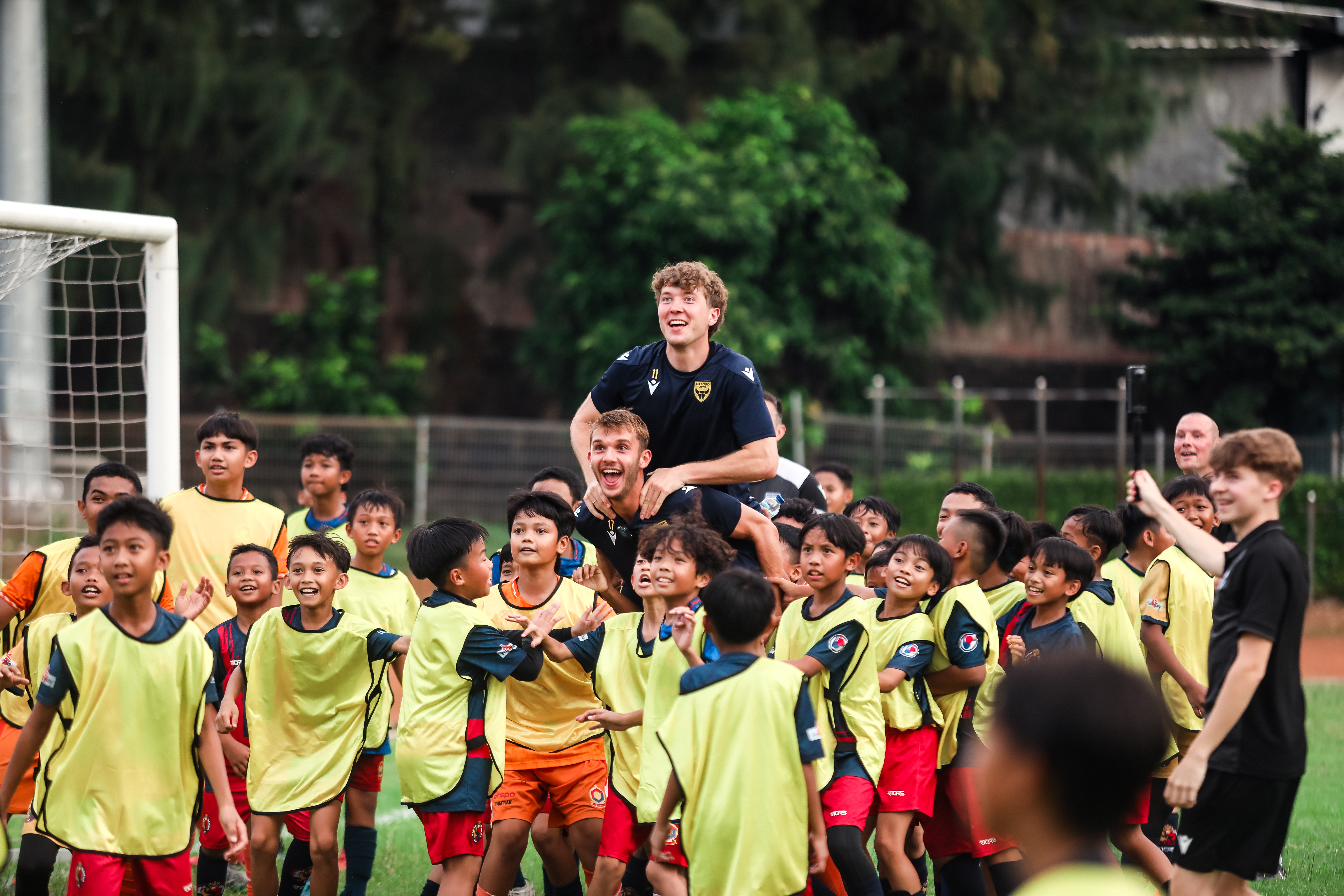 Ole Romeny and Stan Mills with Indonesian children