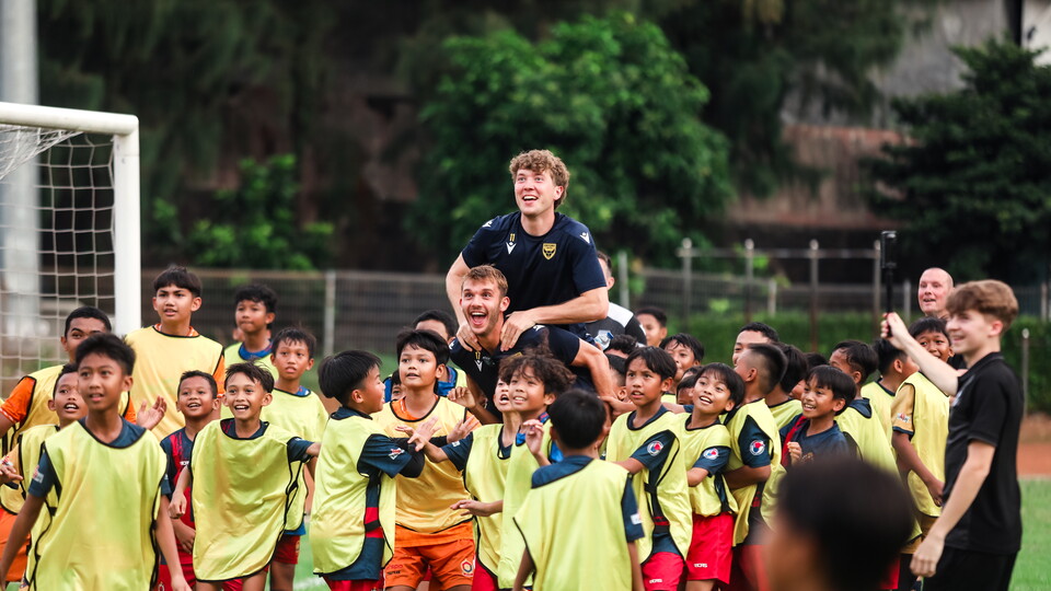 Ole Romeny and Stan Mills with Indonesian children